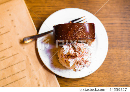 The close-up composition of the chocolate cake The close-up composition of the chocolate cake 34559827