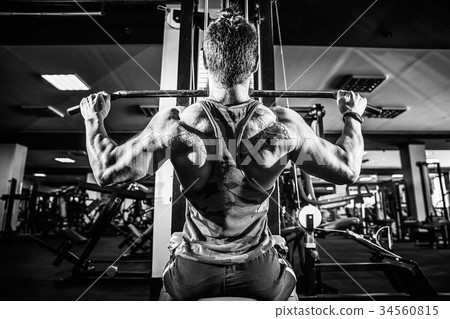 Strong Bodybuilder Doing Heavy Weight Exercise For 34560815