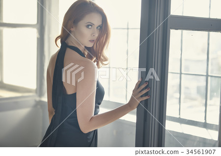 Beautiful sexy young woman. Portrait of girl in long black dress Beautiful sexy young woman. Portrait of girl in long black dress 34561907