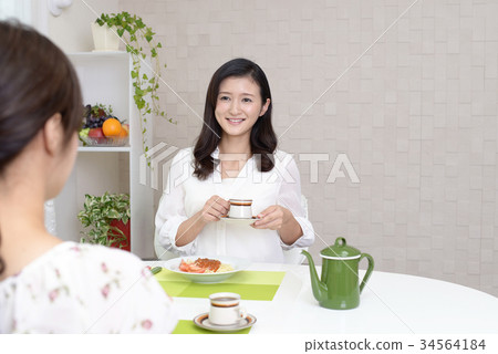 A woman enjoying a meal 34564184