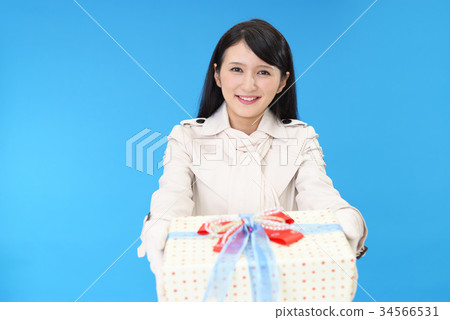 A woman with a present A woman with a present 34566531