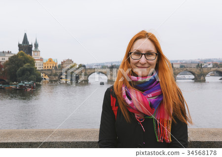 Woman tourist travels in the city park of Prague 34568178
