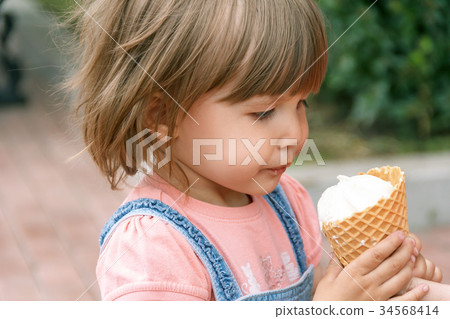 Cute girl are eating icecream Cute girl are eating icecream 34568414