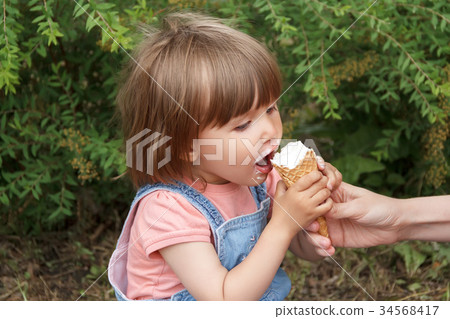 Cute girl are eating icecream Cute girl are eating icecream 34568417