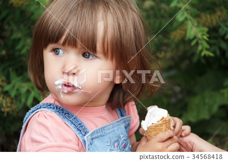 Cute girl are eating icecream Cute girl are eating icecream 34568418