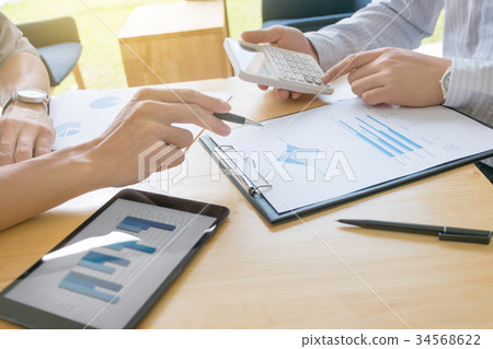 Two business colleagues discussing about data 34568622
