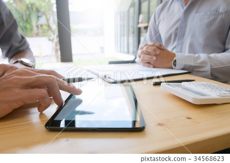 Business people working together and using tablet 34568623