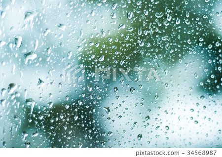 Rain drops on the window glass, water on mirror 34568987
