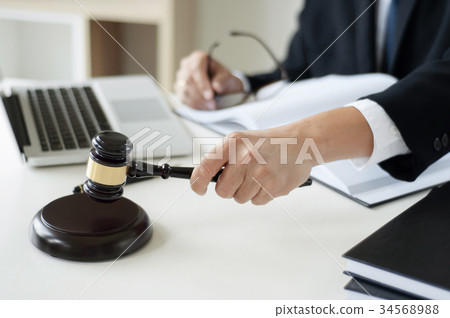 business lawyer hand holding justice hammer 34568988