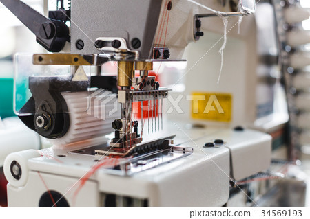 Closeup detail of the sewing machine 34569193