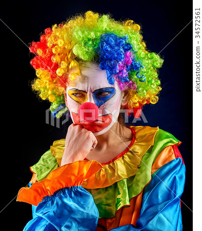 Evil clown on black background. Portrait of crazy 34572561