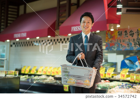 Supermarket shopping male lifestyle image Supermarket shopping male lifestyle image 34572742