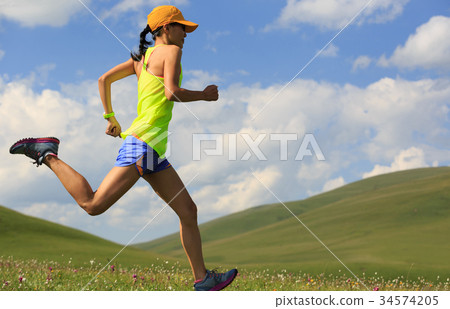fitness woman trail runner running on mountain fitness woman trail runner running on mountain 34574205