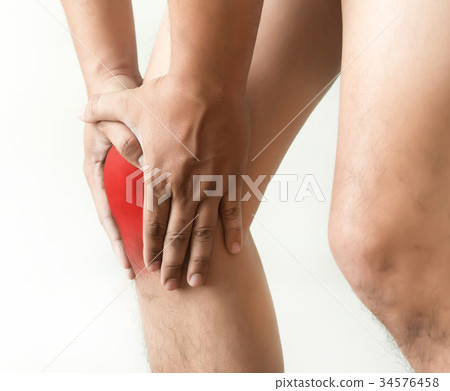 the knee man holds on suffering from pain in 34576458