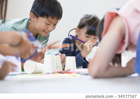 Elementary school student drawing work seriously 34577387