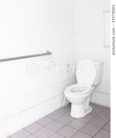 White tiles toilet in a bathroom 34578001