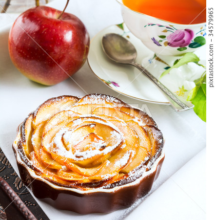 Breakfast tea with sweet apple rose shaped pie 34579965