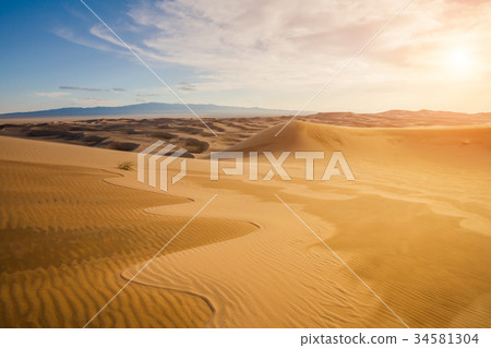 Beautiful sunset in the desert above the sand 34581304