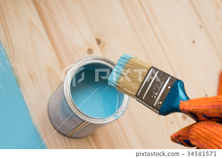 worker paints board worker paints board 34581571