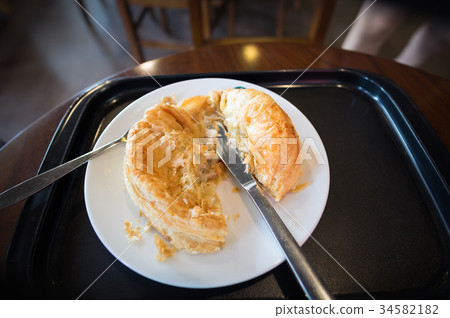 Chicken and mushroom pie on a white plate Chicken and mushroom pie on a white plate 34582182