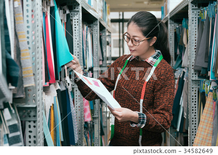 professional young female clothing company worker 34582649