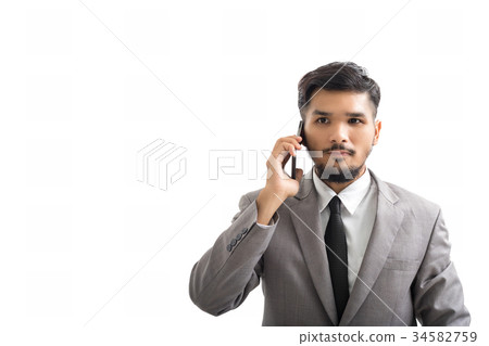 A yong businessman are using smartphone 34582759
