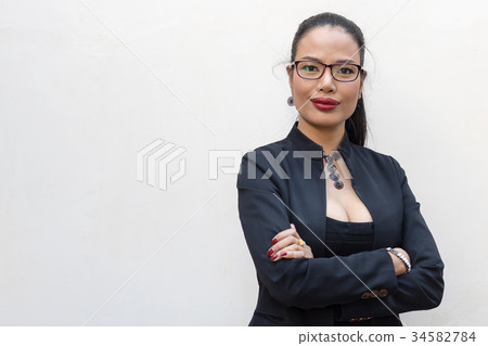 Young businesswoman isolate on a white Young businesswoman isolate on a white 34582784