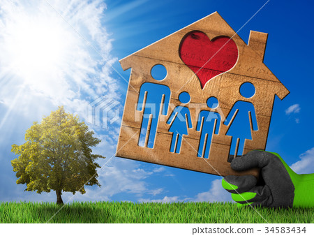 Wooden House with Family on Green Grass 34583434