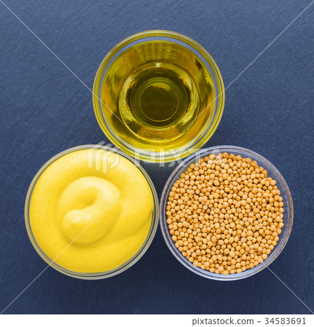 mustard three glass bowl with seeds, fresh mustard 34583691