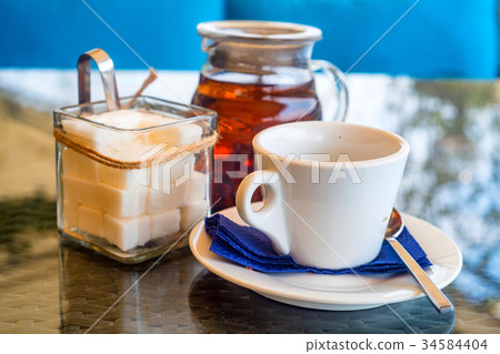 White teaset on tray in restaurant White teaset on tray in restaurant 34584404