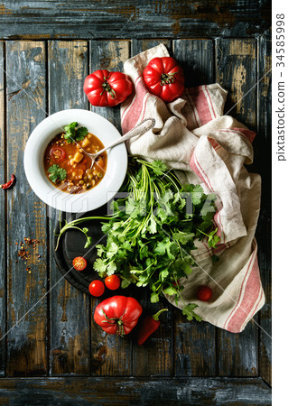 Carrot tomato pea soup 34585998