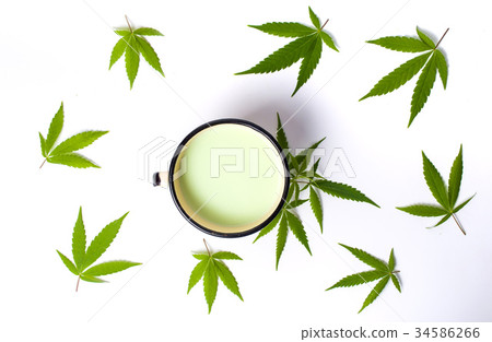Green milk with marijuana on white 34586266