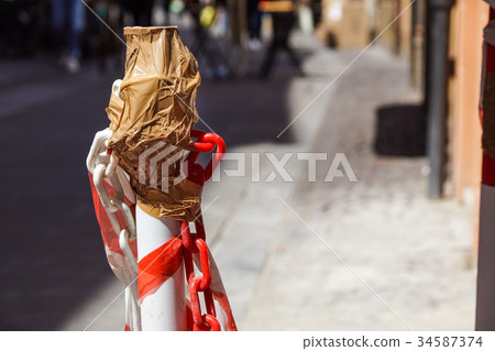 White and red baton used to define a working area 34587374