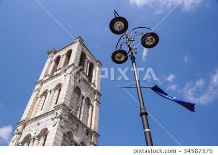 historic medieval tower church With lamppost and 34587376