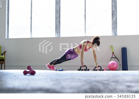 Woman training indoors 34589135
