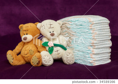 Stack of diapers or nappies with teddy bears Stack of diapers or nappies with teddy bears 34589166