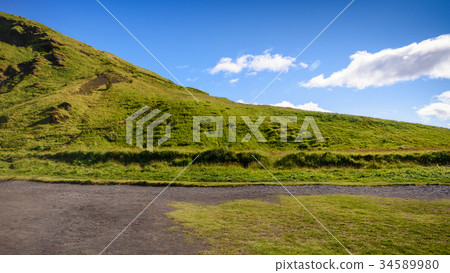 Mountain landscape, blue sky at Skogafoss, Iceland Mountain landscape, blue sky at Skogafoss, Iceland 34589980