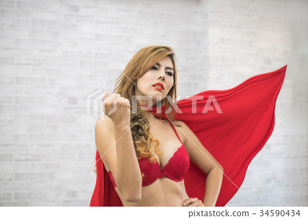 Super sexy girl in sexy red dress showing The strong. Super sexy girl in sexy red dress showing The strong. 34590434