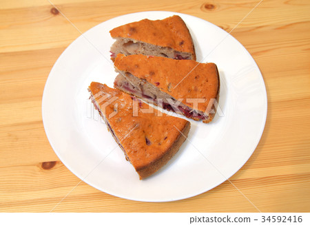 Cherry pie on a plate. 34592416