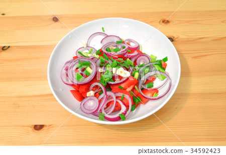 Vegetable salad on plate. 34592423