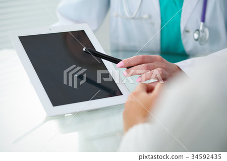 Doctor and patient, close-up of hands.  Physicia 34592435