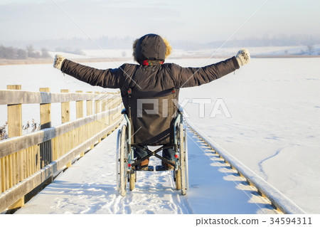 Happy disabled man on wheelchair 34594311