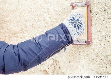 Builder working with grinding tool Builder working with grinding tool 34594415