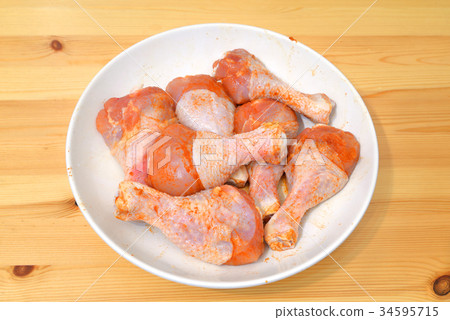 Raw chicken drumstick. Raw chicken drumstick. 34595715
