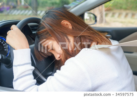 Sleep, tired, close eyes woman driving her car Sleep, tired, close eyes woman driving her car 34597575