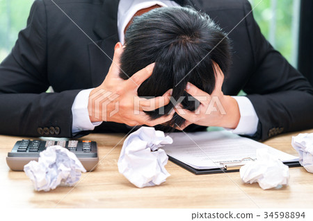Stressed businessman make mistake with paper Stressed businessman make mistake with paper 34598894
