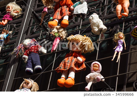 Children's colorful soft toys hanging on strings Children's colorful soft toys hanging on strings 34599666