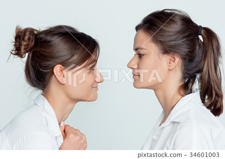 Studio portrait of female twins 34601003