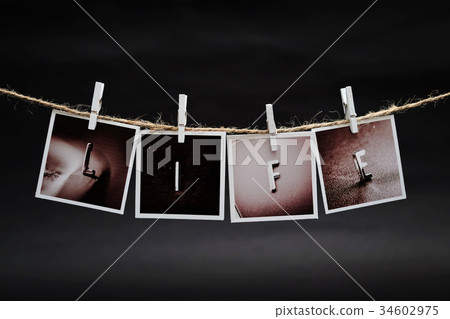 Rows of LIFE letters photo frames hanging Rows of LIFE letters photo frames hanging 34602975