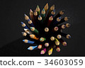 Bunch of color pencils in a dark room 34603059